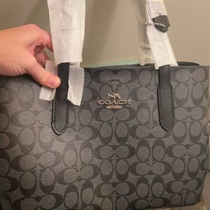 Coach handbag with Shoulder Strap. BNWT. Still has paper wrapping around leather